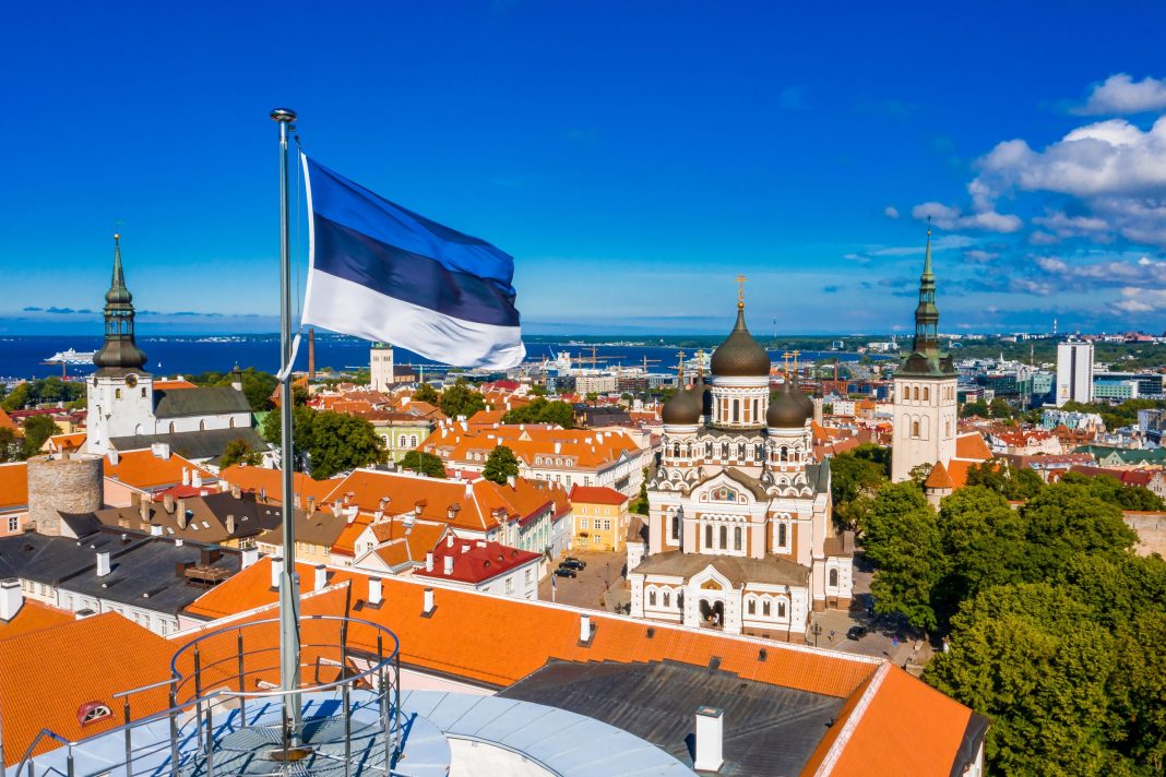 Estonia-flag-over-Tallinn-shutterstock_1880369926-scaled